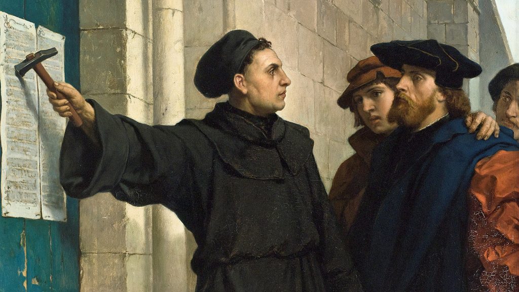 Luther nails the 95 theses to the door sparking the Reformation
